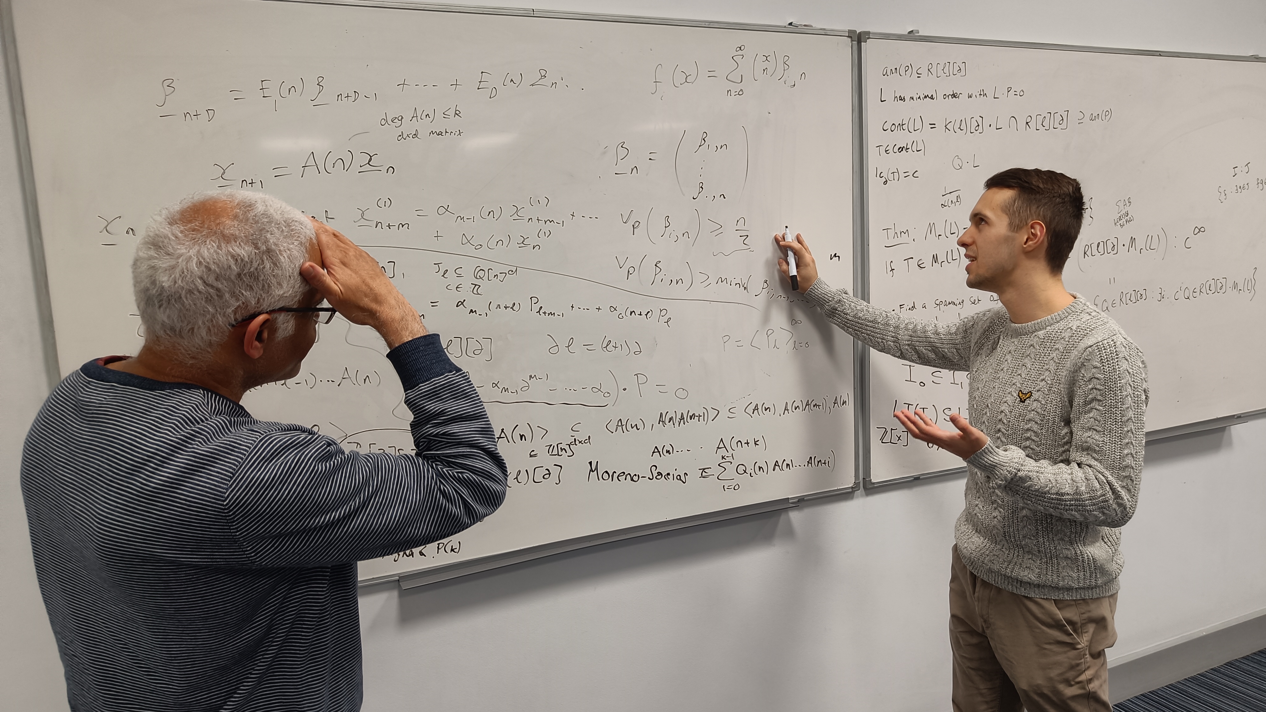 Piotr and Ben discussing some maths